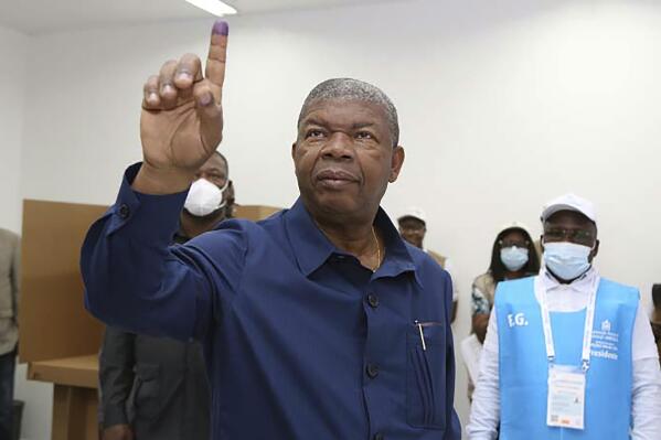 Angola President Joao Lourenco shows his marked finger during the voting process at a polling station in Luanda, Angola, Wednesday, Aug. 24, 2022. President Joao Lourenco is running for a second five-year term while his party, the Peoples' Movement for the Liberation of Angola, known by its Portuguese acronym MPLA, is campaigning to extend its 47-year run as the country's ruling party. (AP Photo)