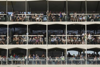 Some of the thousands gathered at the 16th hole during the first round of the Waste Management Phoenix Open PGA Tour golf tournament at the TPC Scottsdale Thursday, Feb. 6, 2025, in Scottsdale, Ariz. (AP Photo/Ross D. Franklin)