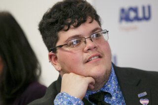 FILE - In this July 23, 2019, file photo, Gavin Grimm, who has become a national face for transgender students, speaks during a news conference held by The ACLU and the ACLU of Virginia at Slover Library in Norfolk, Va. A school board in Virginia is asking the U.S. Supreme Court to review its transgender bathroom ban after rulings by lower courts that the policy is unconstitutional and had discriminated against former student Grimm. 
The Gloucester County School Board filed a petition before the high court on Friday, Feb. 19, 2021, that argues its bathroom policy poses a “pressing federal question of national importance.”  (Kristen Zeis/The Daily Press via AP, File)