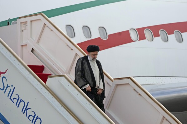 Iranian President Ebrahim Raisi, disembarks from a plane as he arrives in Colombo, Sri Lanka, Wednesday, April 24, 2024. Raisi is the first Iranian leader to visit Sri Lanka since former President Mahmoud Ahmedinejad visited the country in 2008. (AP Photo/Eranga Jayawardena)