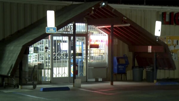This image made from video provided by KBAK shows the exterior of Midway Market & Liquor in Frazier Park, California, on Oct. 12, 2023. A player in California won a $1.765 billion Powerball jackpot Wednesday night, ending a long stretch without a winner of the top prize. The winning ticket was sold at Midway Market & Liquor in Frazier Park, according to the California Lottery.(KBAK via AP)