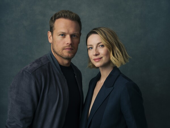 Sam Heughan, left, and Caitriona Balfe pose for a portrait to promote the series "Outlander" on Thursday, June 8, 2023, in New York. (Photo by Drew Gurian/Invision/AP)