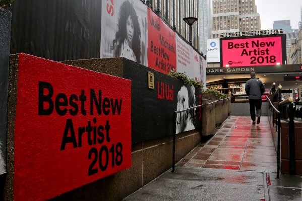
              Signs posted around Madison Square Garden promote the return of the Grammy Awards to New York, Tuesday, Jan. 23, 2018, in New York. The Grammy Awards will be held on Sunday. (AP Photo/Bebeto Matthews)
            