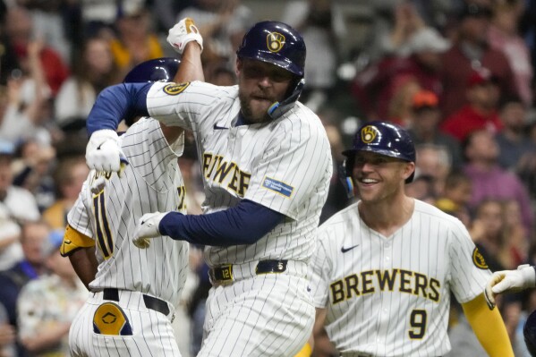 Milwaukee Brewers' Rhys Hoskins celegrates his three-run home run during the seventh inning of a baseball game against the St. Louis Cardinals Saturday, May 11, 2024, in Milwaukee. (AP Photo/Morry Gash)