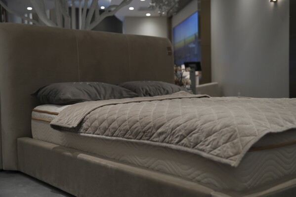 Weighted blankets on display in a Saatva mattress showroom in New York, Dec. 4, 2024. (AP Photo/Mary Conlon)