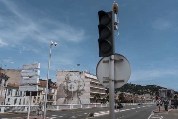Traffic lights are switched off during an electricity outage in Cannes, southern France, Saturday, May 24, 2025. (AP Photo/Lewis Joly)