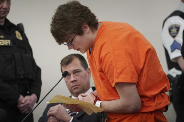 Gunman Payton Gendron reads an apology to the court at his sentencing before Erie County Court Judge Susan Eagan, Wednesday, Feb. 15, 2023, in Buffalo, N.Y. Gendron, a white supremacist who killed 10 Black people at a Buffalo supermarket was sentenced to life in prison without parole Wednesday after relatives of his victims confronted him with the pain and rage caused by his racist attack. (Derek Gee/The Buffalo News via AP, Pool)