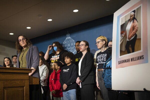 Rep. Leigh Finke and members of Minnesota's House DFL Queer Caucus gather at the State Capitol on Thursday, Dec. 7, 2023, in St. Paul, Minn., in response to the murder of transgender woman Savannah Williams on Nov. 29. (Ben Hovland/Minnesota Public Radio via AP)