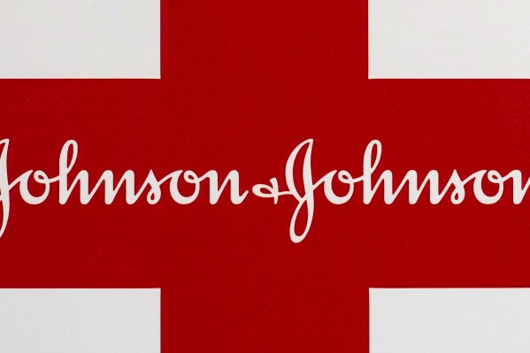 FILE - A Johnson & Johnson logo is seen in Walpole, Mass., Feb. 24, 2021. Johnson & Johnson is pumping more money into heart care with a roughly $13 billion deal for Shockwave Medical, which specializes in technology that helps open clogged arteries. (AP Photo/Steven Senne, file)