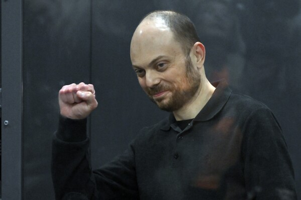 FILE - Russian opposition activist Vladimir Kara-Murza gestures standing in a glass cage in a courtroom during announcement of the verdict on appeal at the Moscow City Court in Moscow, Russia, on July 31, 2023. (AP Photo, File)