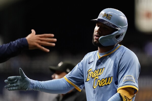 Milwaukee Brewers' Jackson Chourio is congratulated after hitting an RBI single during the fourth inning of a baseball game against the New York Mets, Friday, Sept. 27, 2024, in Milwaukee. (AP Photo/Aaron Gash)