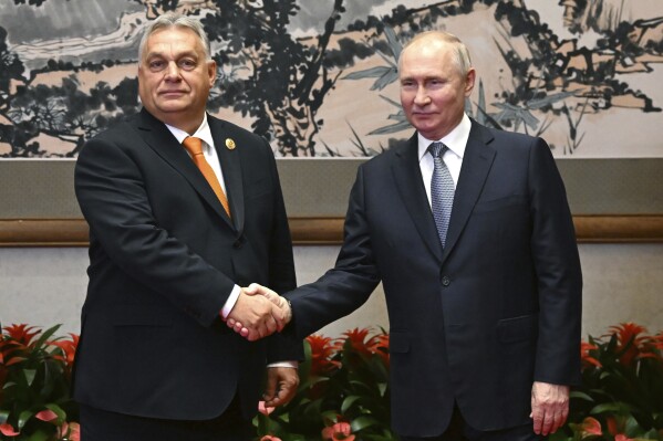 Russian President Vladimir Putin, right, and Hungarian Prime Minister Viktor Orban pose for a photo prior to their talks on the sidelines of the Belt and Road Forum in Beijing, China, on Tuesday, Oct. 17, 2023. (Grigory Sysoyev, Sputnik, Kremlin Pool Photo via AP)