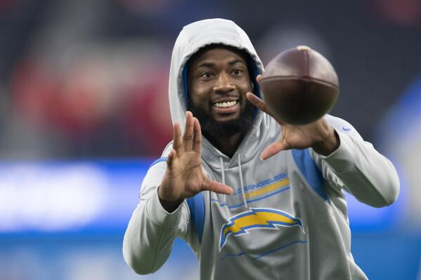 FILE - Los Angeles Chargers wide receiver Mike Williams (81) warms up before an NFL football game against the Kansas City Chiefs Thursday, Dec. 16, 2021, in Inglewood, Calif. Mike Williams will remain a valuable part of the Los Angeles Chargers offense for the next three seasons. The wide receiver has agreed to a contract extension with the franchise on Tuesday, March 8, 2022. (AP Photo/Kyusung Gong, File)