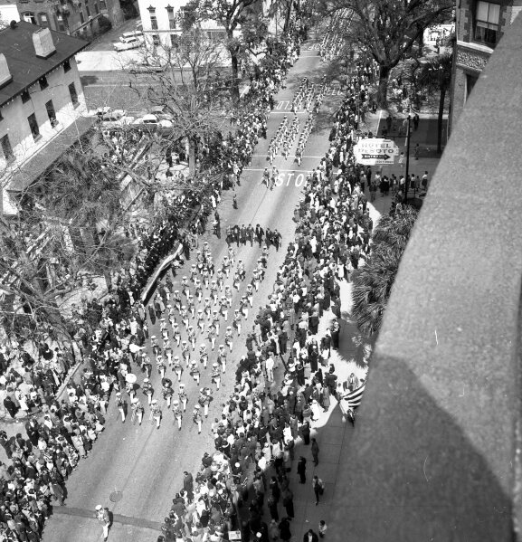 This March 17, 1962 photo shows the St. Patrick's Day parade in Savannah, Ga. Savannah, Georgia's oldest city, is planning a supersized celebration as it marks the 200th anniversary of its beloved St. Patrick's Day parade. City Manager Jay Melder says he's expecting historic crowds for the Irish-themed parade Saturday, March 16, 2024. (Gene Taggart/Savannah Morning News via AP)