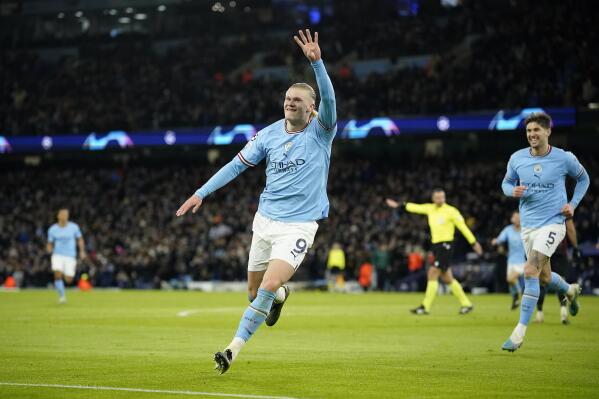 Manchester City's Erling Haaland celebrates after scoring his side's 5th goal during the Champions League round of 16 second leg soccer match between Manchester City and RB Leipzig at the Etihad stadium in Manchester, England, Tuesday, March 14, 2023. (AP Photo/Dave Thompson)
