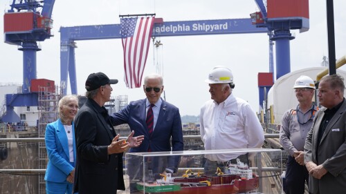 President Joe Biden talks with Lasse Petterson, CEO of Great Lakes Dredge and Dock, second from left, as he tours a shipyard in Philadelphia, Thursday, July 20, 2023. Rep. Mary Gay Scanlon, D-Pa., left, and Steinar Nerbovik, CEO of Philadelphia Shipyard, Inc., third from right, look on. (AP Photo/Susan Walsh)