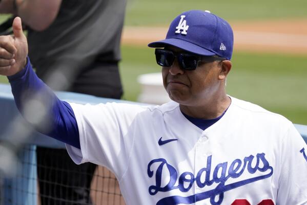 Los Angeles Dodgers manager Dave Roberts gives a thumbs up in the dugout during of the first game of a baseball double-header against the Arizona Diamondbacks Tuesday, May 17, 2022, in Los Angeles. (AP Photo/Marcio Jose Sanchez)
