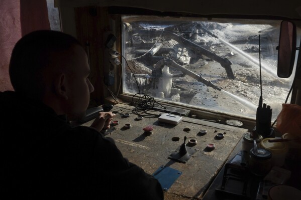 A worker controls extraction of ilmenite, a key element used to produce titanium, in an open pit mine in the central region of Kirovohrad, Ukraine, Wednesday, Feb. 12, 2025. (AP Photo/Efrem Lukatsky, File)