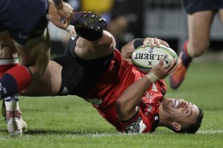 Crusaders Ryan Crotty scores his team's final try during the Super Rugby match between the Crusaders and the Melbourne Rebels in Christchurch, New Zealand, Saturday, June 8, 2019. The Crusaders defeated the Melbourne Rebels 66-0. (AP Photo/Mark Baker)