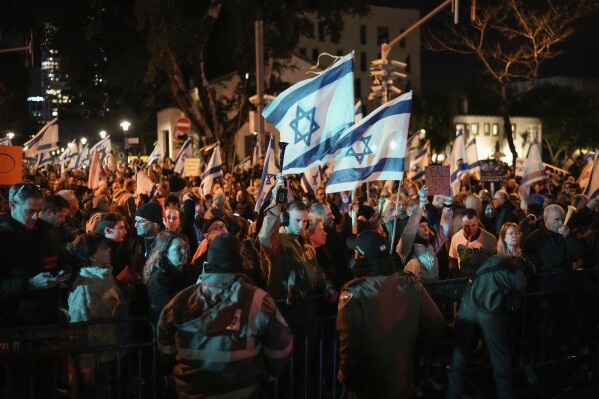 FILE - Demonstrators protest against Israeli Prime Minister Benjamin Netanyahu and call for new elections in the latest weekly protest against his handling of the Israel-Hamas war, in Tel Aviv, Israel, Saturday, Feb. 17, 2024. Israel can either try to annihilate Hamas, which would mean almost certain death for the estimated 100 hostages still held in Gaza, or it can cut a deal that would allow the militants to claim a historic victory. Either outcome would be excruciating for Israelis. And either might be seen as acceptable by Hamas, which valorizes martyrdom. (AP Photo/Leo Correa, File)