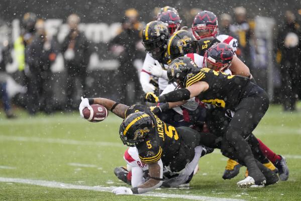 Hamilton Tiger Cats running back Don Jackson (5) is taken down by