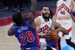 Toronto Raptors guard Fred VanVleet looks to shoot as Detroit Pistons center Isaiah Stewart (28) defends during the first half of an NBA basketball game, Wednesday, March 17, 2021, in Detroit. (AP Photo/Carlos Osorio)