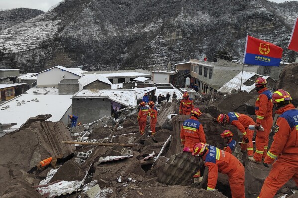 In this photo released by Xinhua News Agency, rescue workers search the site of a landslide in Liangshui village, Tangfang Town in the city of Zhaotong, southwestern China's Yunnan Province, Monday, Jan. 22, 2024. The landslide in southwestern China's mountainous Yunnan province early Monday buried dozens and forced the evacuation of hundreds. (Xinhua via AP)