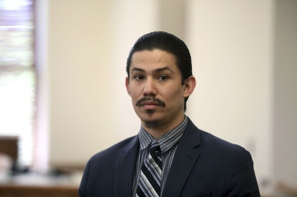 Anthony Martinez watches as the jury members leave the courtroom on Thursday, May 23, 2024, in Flagstaff, Ariz., after the jury found Martinez guilty of all charges including first-degree murder in the 2020 starvation death of his 6-year-old son. (Jake Bacon/Arizona Daily Sun via AP)