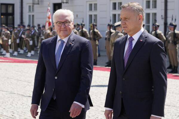 Germany's President Frank-Walter Steinmeier, left, and his Polish host, President Andrzej Duda, right, attend a military welcome ceremony at the Presidential Palace in Warsaw, Poland, Thursday, June 17, 2021 at the start of Steinmeier's brief visit marking 30 years of bilateral good-neighborly relations treaty. Their talks are expected to include the future of the European Union and its tran-Atlantic ties, the developments in Ukraine and Belarus and the divisive Nord Stream 2 gas pipeline between Russia and Germany. (AP Photo/Czarek Sokolowski)