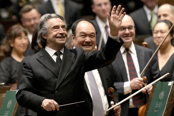 Riccardo Muti, musical director of the Chicago Symphony Orchestra waves goodbye to the audience after conducting the orchestra and chorus in Beethoven's "Missa Solemnis" in D Major, Op. 123, Sunday, June 25, 2023, in Chicago. Sunday marked the last performance by Muti, 81, in Orchestra Hall during his 13 year tenure. (AP Photo/Charles Rex Arbogast)