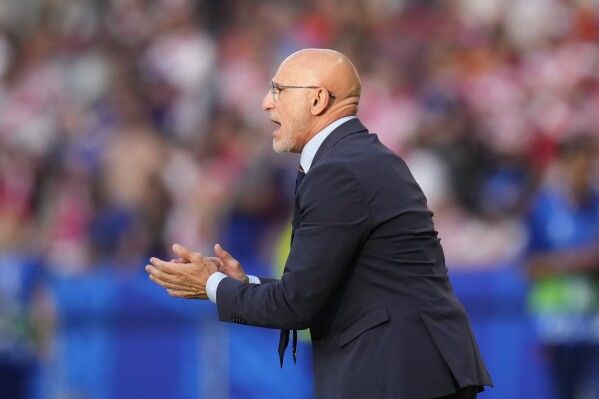 Spain's head coach Luis de la Fuente gives instructions during a Group B match between Spain and Croatia at the Euro 2024 soccer tournament in Berlin, Germany, Saturday, June 15, 2024. Spain defeated Croatia 3-0. (AP Photo/Manu Fernandez)