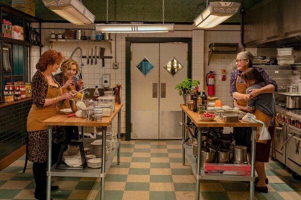 This image released by Netflix shows Susan Sarandon, from left, Brenda Vaccaro, Lorraine Bracco as Roberta and Talia Shire in a scene from "Nonnas." (Jeong Park/Netflix via AP)