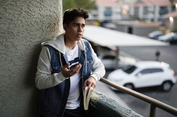 Marcelo Conde poses for a portrait at his apartment Wednesday, Jan. 17, 2024, in Las Vegas. Conde, a political journalist from Nicaragua, fled Nicaragua last year after he received death threats because he wasn't in favor of leftist President Daniel Ortega. (AP Photo/John Locher)