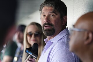 Helton teams up with organization to eliminate $10 million in