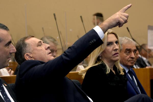 Newly elected President of Republika Srpska Milorad Dodik, center, gestures during an inaugural session of the National Assembly, where he will be sworn in, in the Bosnian town of Banja Luka, 240 kms northwest of Sarajevo, Tuesday, Nov. 15, 2022. Pro-Russian Bosnian Serb leader Milorad Dodik has been elected after serious allegations about election voter fraud and corruption following October elections in Bosnia. (AP Photo/Radivoje Pavicic)