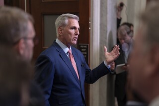 Speaker of the House Kevin McCarthy, R-Calif., talks to reporters outside his office about calls for an impeachment inquiry of President Joe Biden, at the Capitol in Washington, Tuesday, July 25, 2023. (AP Photo/J. Scott Applewhite)