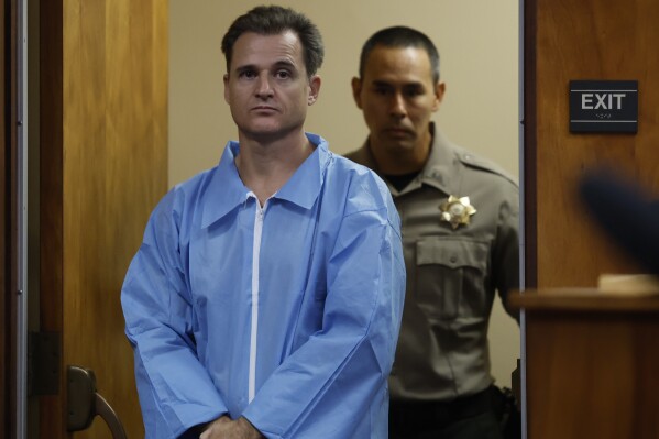 Gerhardt Konig, charged with the attempted murder of his wife, enters a courtroom in Honolulu on Tuesday, May 13, 2025. (Jamm Aquino/Honolulu Star-Advertiser via AP) **NOT AN AP MEMBER**