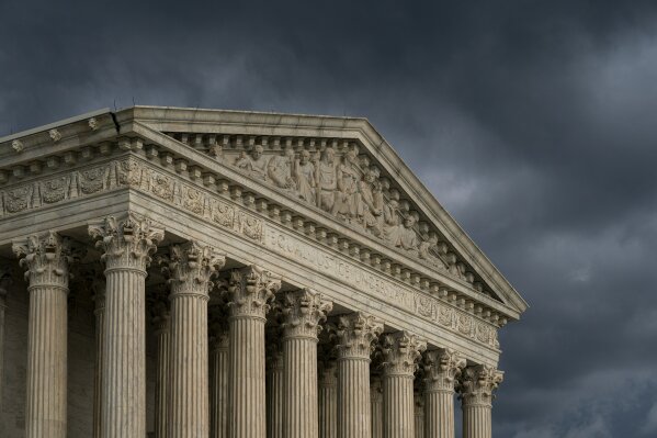 In this June 20, 2019 photo, The Supreme Court is seen under stormy skies in Washington. The justices on Monday left in place a Maryland court ruling that denied a new trial to Adnan Syed, who was ...
