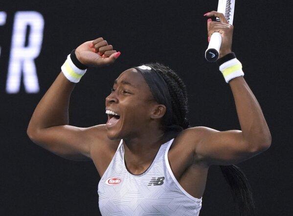 Coco Gauff of the U.S. celebrates after defeating Japan's Naomi Osaka in their third round singles match at the Australian Open tennis championship in Melbourne, Australia, Friday, Jan. 24, 2020. (AP Photo/Lee Jin-man)