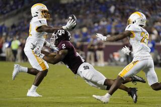 Kent State linebacker Khalib Johns, left, intercepts a pass meant for Texas A&M wide receiver Chase Lane (2) during the second half of an NCAA college football game on Saturday, Sept. 4, 2021, in College Station, Texas. (AP Photo/Sam Craft)