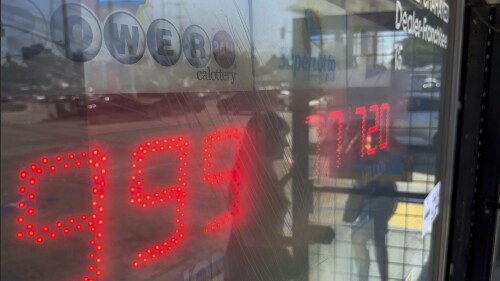 People buy Powerball tickets at Joe's Service Center, a Mobil gas station that previously sold the $2.04 billion-winning Powerball ticket at Woodbury Road and Fair Oaks Avenue in Altadena, Calif., Wednesday, July 19, 2023. The Powerball jackpot rose yet again to an estimated $1 billion after no winning ticket was sold for the latest drawing. (AP Photo/Damian Dovarganes)