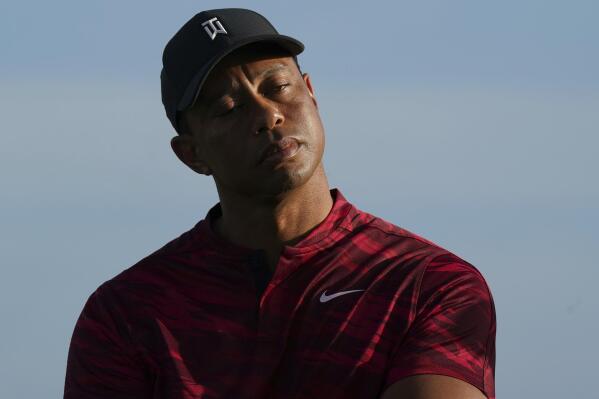 Tiger Woods gestures during the trophy ceremony of the Hero World Challenge PGA Tour at the Albany Golf Club, in New Providence, Bahamas, Sunday, Dec. 5, 2021.(AP Photo/Fernando Llano)