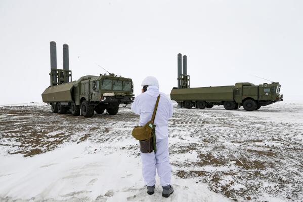 An officer speaks on walkie-talkie as the Bastion anti-ship missile systems take positions on the Alexandra Land island near Nagurskoye, Russia, Monday, May 17, 2021. Bristling with missiles and radar, Russia's northernmost military base projects the country's power and influence across the Arctic from a remote, desolate island amid an intensifying international competition for the region's vast resources. Russia's northernmost military outpost sits on the 80th parallel North, projecting power over wide swathes of Arctic amid an intensifying international rivalry over the polar region's vast resources. (AP Photo/Alexander Zemlianichenko)