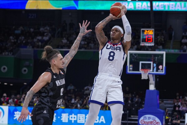 U.S. forward Paolo Banchero (8) shoots over New Zealand forward Isaac Fotu (42) during the second half of a Basketball World Cup group C match in Manila, Saturday, Aug. 26, 2023. (AP Photo/Michael Conroy)