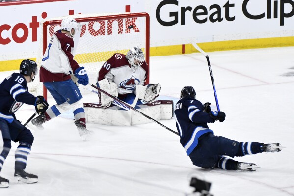 Winnipeg Jets' Vladislav Namestnikov (7) scores on Colorado Avalanche goaltender Alexandar Georgiev (40) during the first period in Game 1 of an NHL hockey Stanley Cup first-round playoff series in Winnipeg, Manitoba, on Sunday, April 21, 2024. (Fred Greenslade/The Canadian Press via AP)