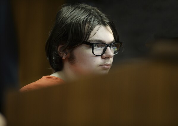 Ethan Crumbley listens to testimony from Dr. Colin King during his hearing at Oakland County Circuit Court, Tuesday, Aug. 1, 2023 in Pontiac, Mich. A Michigan judge is expected to hear the third and final day of testimony Tuesday at a unique sentencing hearing for the Oxford High School shooter. (Clarence Tabb Jr./Detroit News via AP, Pool)