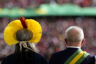 Indigenous leader Cacique Raoni and incoming President Luiz Inacio Lula da Silva stand side by side at the Planalto Palace after Lula's swearing-in ceremony, in Brasilia, Brazil, Jan. 1, 2023. (AP Photo/Eraldo Peres)