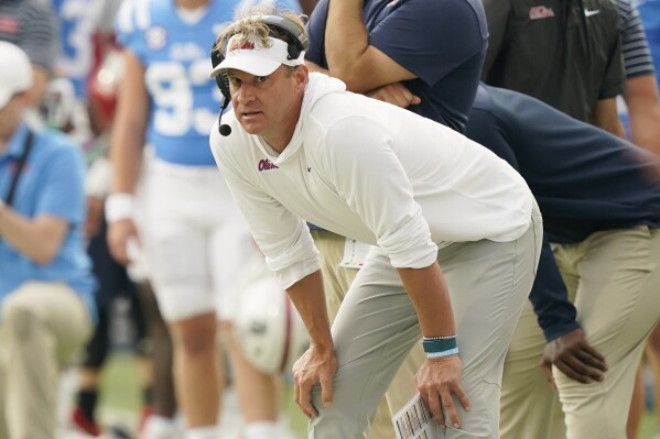 FILE -Mississippi head coach Lane Kiffin watches his players make a play against Auburn during the first half of an NCAA college football game in Oxford, Miss., Saturday, Oct. 15, 2022. Mississippi coach Lane Kiffin has agreed to a contract extension. Vice Chancellor for Intercollegiate Athletics Keith Carter announced the agreement Tuesday, Dec. 19, 2023 but didn't disclose any details.(AP Photo/Rogelio V. Solis, File)