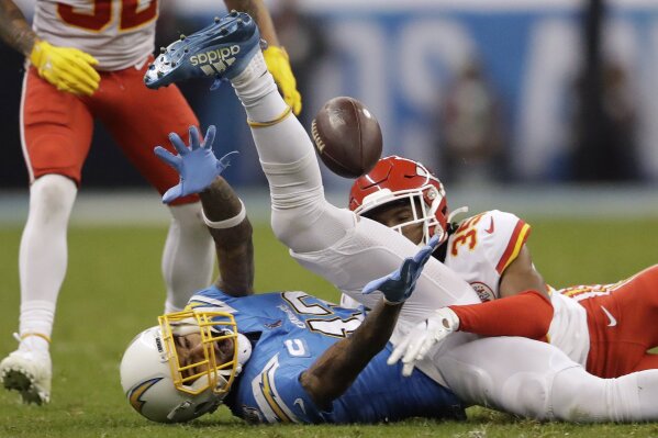 Los Angeles Chargers wide receiver Keenan Allen, left, can't make the catch as Kansas City Chiefs cornerback Charvarius Ward, right, defends, during the second half of an NFL football game Monday, Nov. 18, 2019, in Mexico City. (AP Photo/Marcio Jose Sanchez)