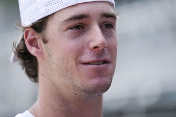 Georgia's Charlie Condon speaks to the media before an NCAA college baseball practice, Wednesday, May 15, 2024, in Athens, Ala. (AP Photo/Brynn Anderson)